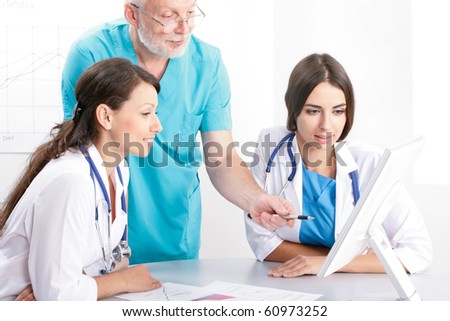 Medical theme: doctors are studying a medical report