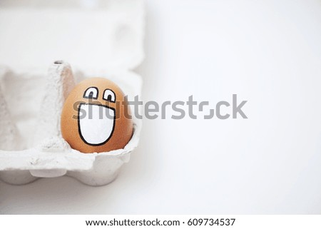 smiling egg on a white background in the stand