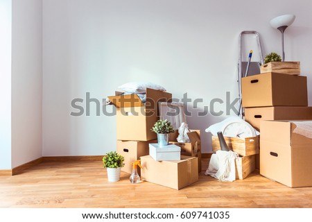 Move. Cardboard boxes and cleaning things for moving into a new home Royalty-Free Stock Photo #609741035