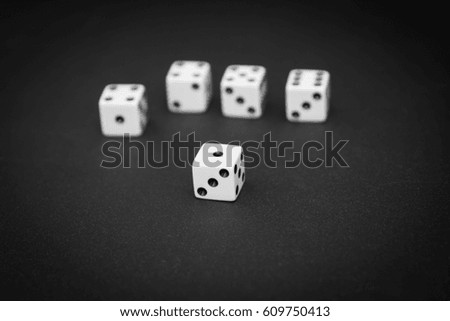 Spilled dices isolated on black background