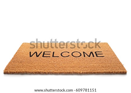 Welcome doormat isolated on white background Royalty-Free Stock Photo #609781151