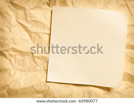 paper note on wrinkled paper background