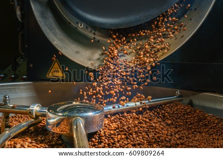 Mixing roasted coffee Royalty-Free Stock Photo #609809264