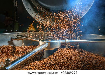 Mixing roasted coffee Royalty-Free Stock Photo #609809297