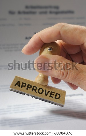 rubber stamp marked with approved Royalty-Free Stock Photo #60984376