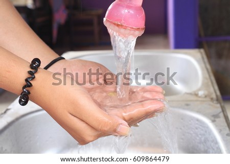 Hand Cupping Water With Droplets  with Hands, Save water Save life, Environmental protection concept, World water day.Clean and can drink