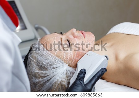 Non-surgical face lifting. SMAS lifting ultrasonic. Facelift. The process of rejuvenation. Spa treatment. Hardware cosmetology. Royalty-Free Stock Photo #609885863