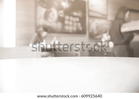 Picture blurred  for background abstract and can be illustration to article of business woman working with laptop in cafe