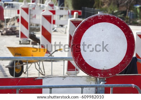 Road work and a no entrance sign