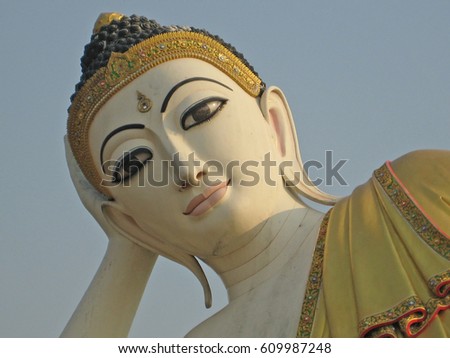 lying buddha face