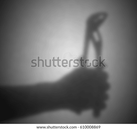 Silhouette behind a transparent paper - Blurred - Pipe wrench