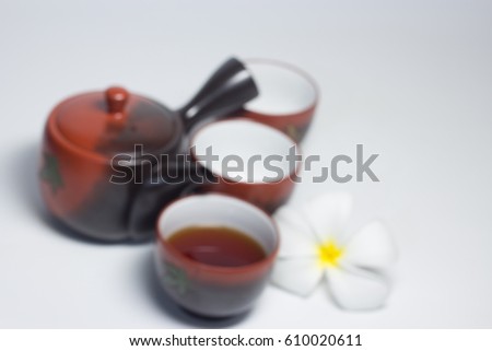 Cup of tea with teapot