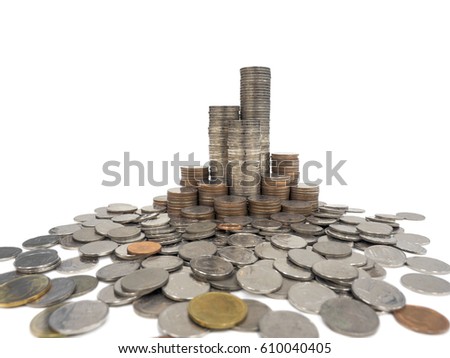 High resolution close up shot of coin towers in coins kingdom. Stacks of different value Thai baht coins look like tower or castle surrounded by coins on white background
