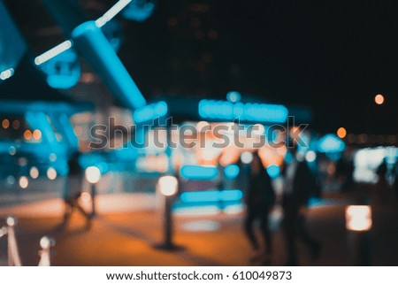 Abstract blur image of people walking in night street
