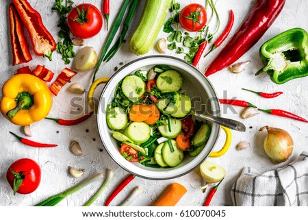 cooking vegetables on the stone background top view
