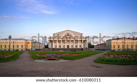 Old Stock Exchange in the morning light, summer blue sky, green flowerbeds, Saint-Petersburg, Russia Royalty-Free Stock Photo #610080311