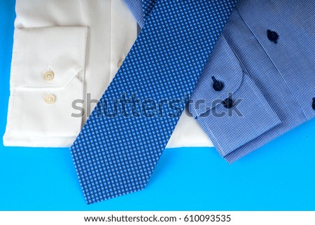 Stack of blue and white shirt closeup on a light background