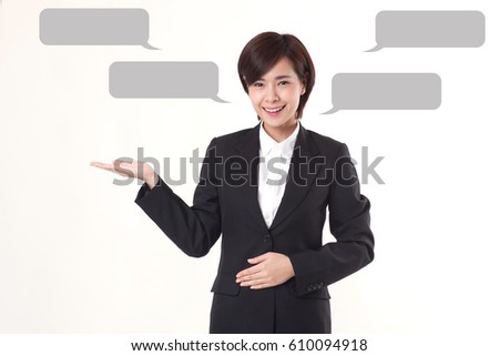 young beautiful office lady is presenting something on the isolated white background having the quoting balloons to retouch any statements on them