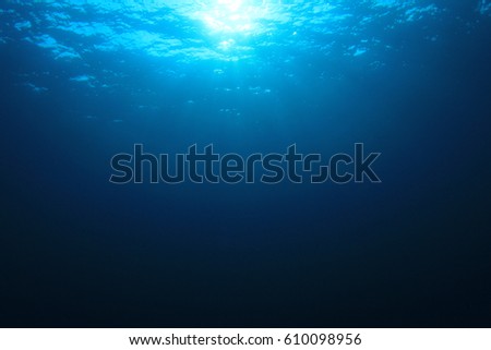 Underwater blue ocean background and sunburst