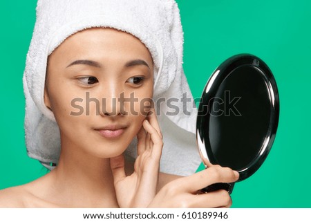       Japanese woman with a towel on her head, clean skin, problem skin,          