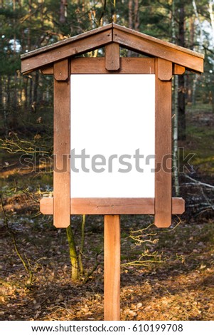 Wooden empty white board sign for your text, message or picture in wooden fram in the forest photo shot