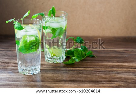 A cool drink of   Mojito on the table. Cocktail preparation for a party. Banner for cafe