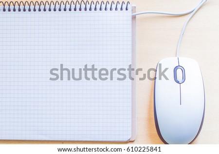 computer mouse and notebook
