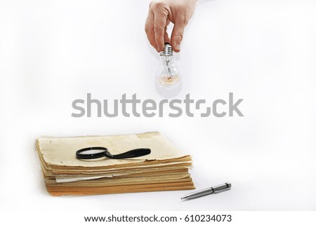Old book with pen. Abstract composition of idea creating. Isolated documents on white background.