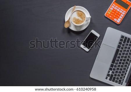 Office stuff and it gadgets display on top view business desk with copy space at text of picture. Creative table, modern project. Business empty laptop smartphone on wood background.