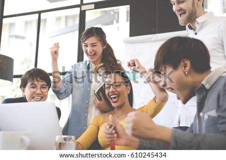 Group of people various nationality glad and cheerful for success them work with laptop at modern office. Feeling happy and enjoy with achievement project. With soft tone. Royalty-Free Stock Photo #610245434