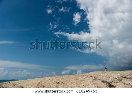 Rock mountain with blue sky and cloudy.