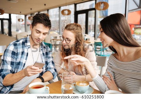 Friends using smartphones together