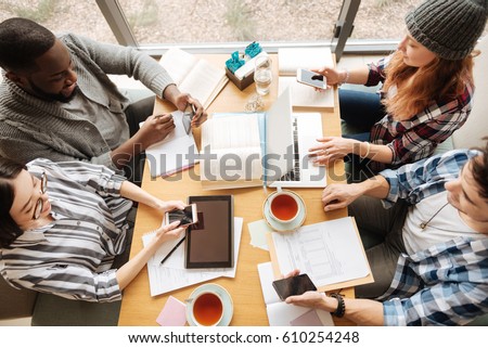 Top view of students studying together Royalty-Free Stock Photo #610254248