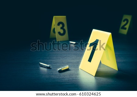 High contrast image of a crime scene with evidence markers Royalty-Free Stock Photo #610324625
