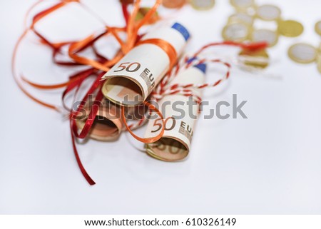 Abstract photo of euro money. Bundle of 50 euros with a ribbon