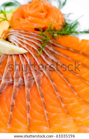 sliced smoked salmon served with lemon and ginger