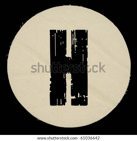 Letter a in leather, on a black isolated background. UPPERCASE