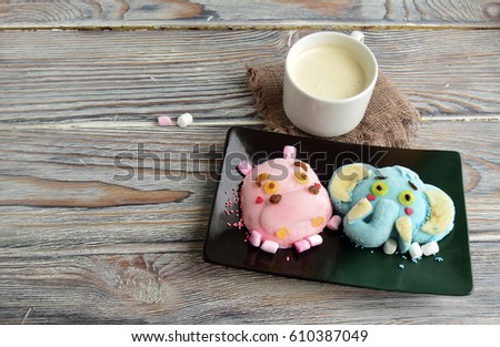 The hippopotamus, elephant are made of ice cream and coffee. A creative dessert for children and good mood.