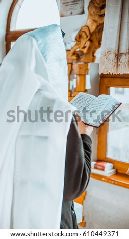jewish prayer with tallit and tefillin Royalty-Free Stock Photo #610449371