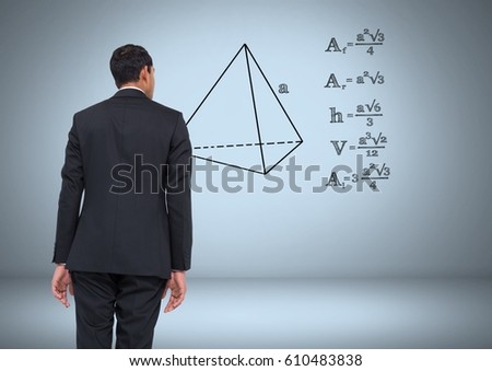 Digital composite of Businessman looking at equations graphic drawings