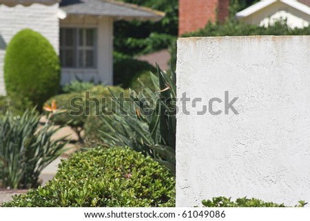 Space for text in front of a suburban residential home. Add your text to the empty space.