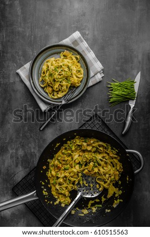 Creamy pasta with chicken, styled rustic moody photo