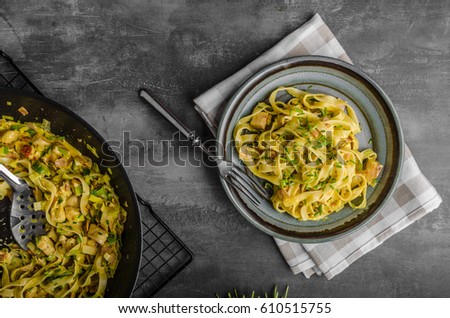 Creamy pasta with chicken, styled rustic moody photo