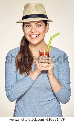 Young woman holding glass with vitamin drink. Happy girl isolated portrait.