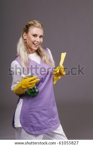 Cleaning woman on violet background