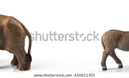 American politics, election and democracy concept with donkey (symbol for democrat, liberal, progressive) and elephant (symbolizing republican, conservative, traditionalist) with border and copy space Royalty-Free Stock Photo #610611305
