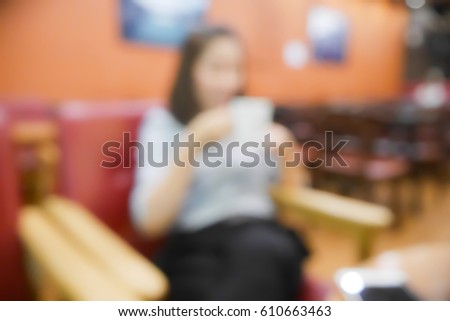 Picture blurred abstract background of asian woman drink coffee in coffee shop