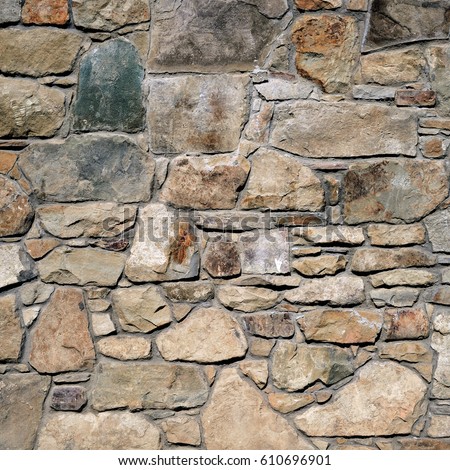 Fragment of a wall from a chipped stone Royalty-Free Stock Photo #610696901