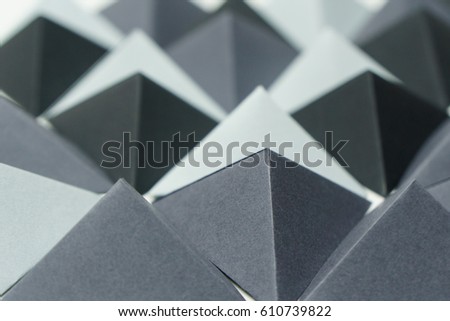 Gray tones origami tetrahedrons background.