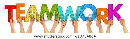 hands holding up colorful wooden letters shaping the word teamwork isolated on white background